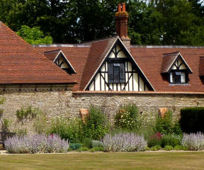Photo of house with stone wall Photo of house with stone wall