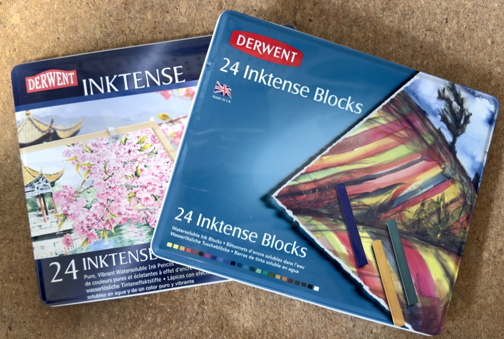 My Derwent Inktense pencils tin beside the 24 Inktense Blocks tin