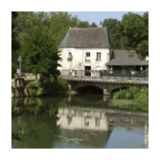 Waterside scene showing a building and bridge reflected in a river, used as an example for drawing reflections.