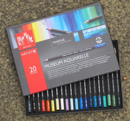 An open box of Caran D'Ache Museum Aquarelle watercolour pencils