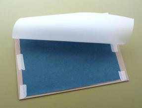 Protective sheet taped to the top of my drawing paper Protective sheet taped to the top of my drawing paper