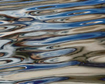 Photo of curved reflections on water Photo of curved reflections on water