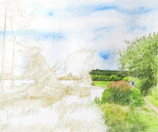 Adding the blue sky between the clouds with watercolor pencil pigment