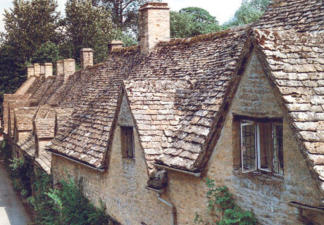 Hand-cut quarried stone roof tiles with irregular edges
