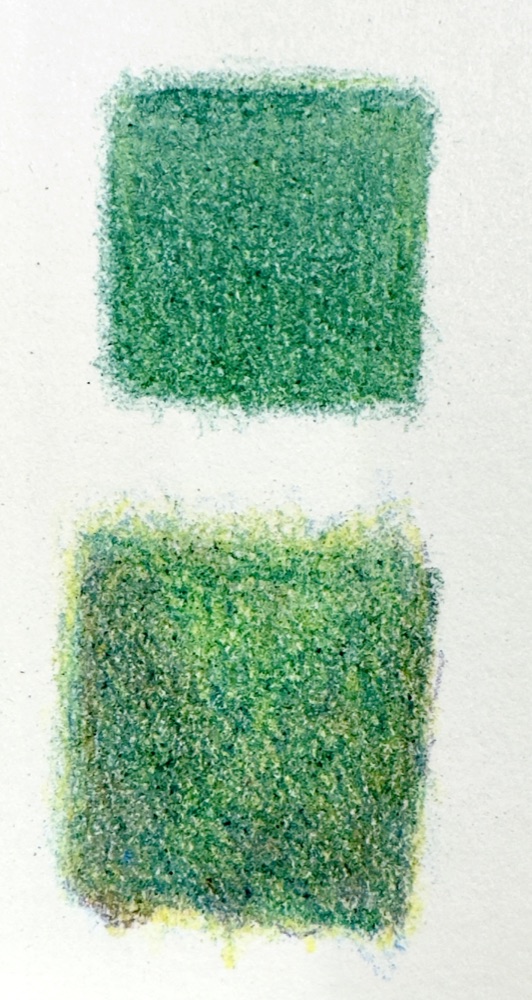 Two green coloured pencil squares, an even flat green above and a livelier uneven layered green below