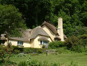 A weathered thatched roof gone grey with age