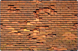 Traditional baked clay roof tiles, some shifted out of line with age