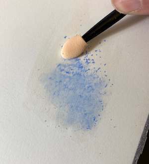 watercolour pencil shavings scattered onto wet paper before blending